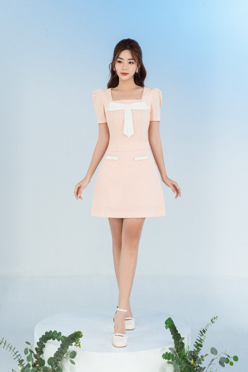 Chân váy A túi ốp đính nơ