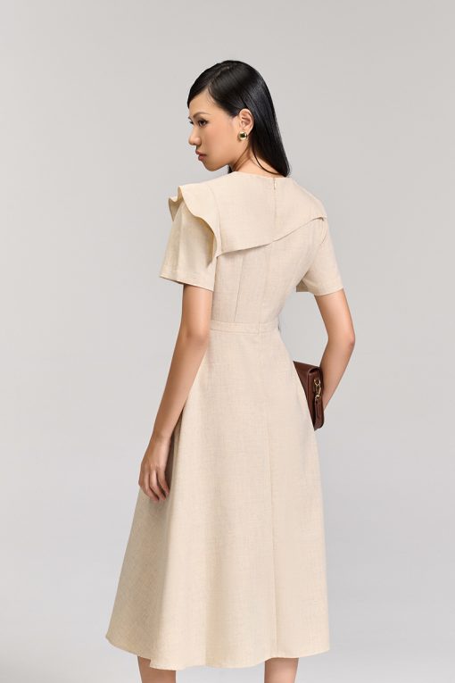 Đầm xoè bong ngực đính cúc trang trí