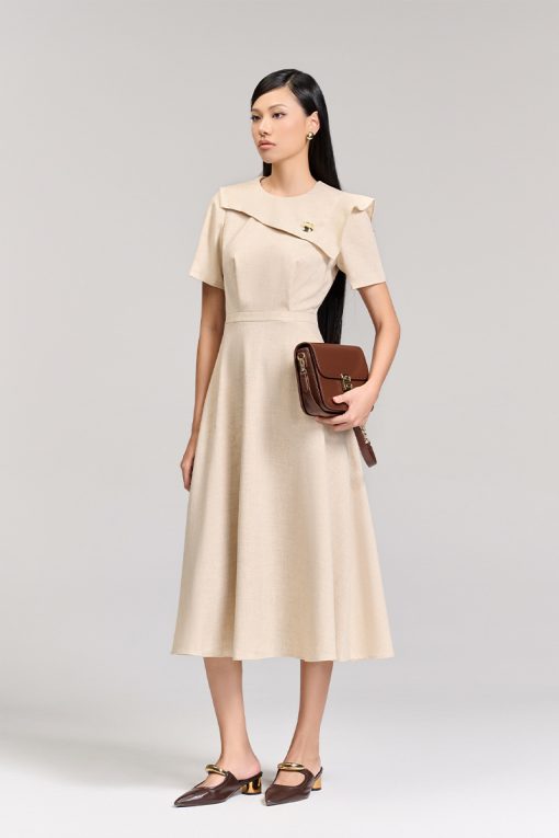 Đầm xoè bong ngực đính cúc trang trí