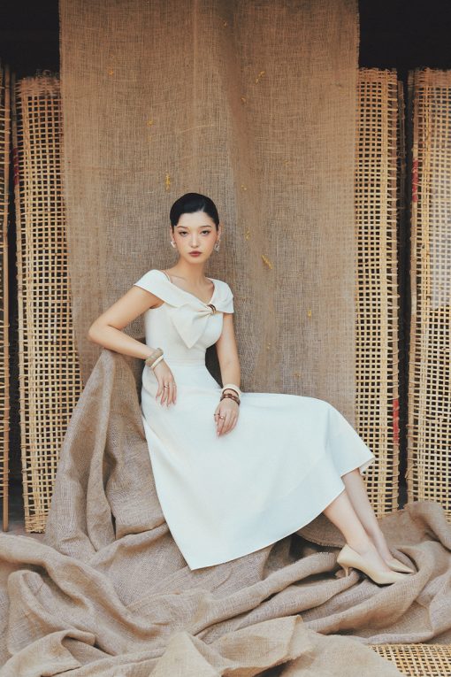 Đầm party nơ liền tay luồn khoen