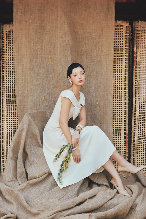 Đầm party nơ liền tay luồn khoen